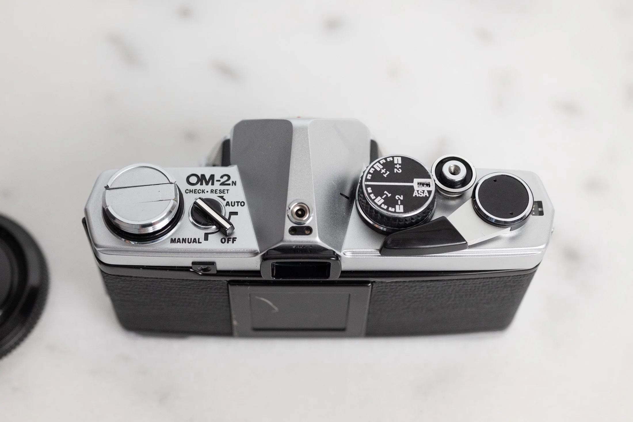 Olympus OM-2n 35mm Film SLR Camera with Body Cap and New Batteries